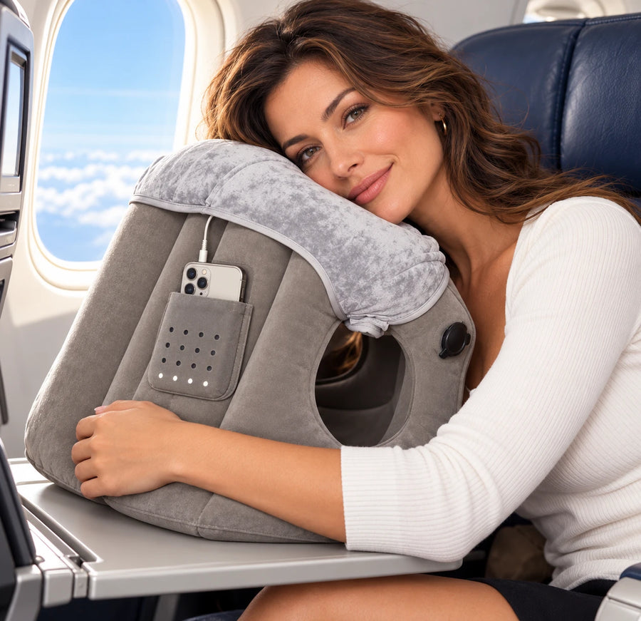 AeroNestly Pro side pocket holding a phone on a flight